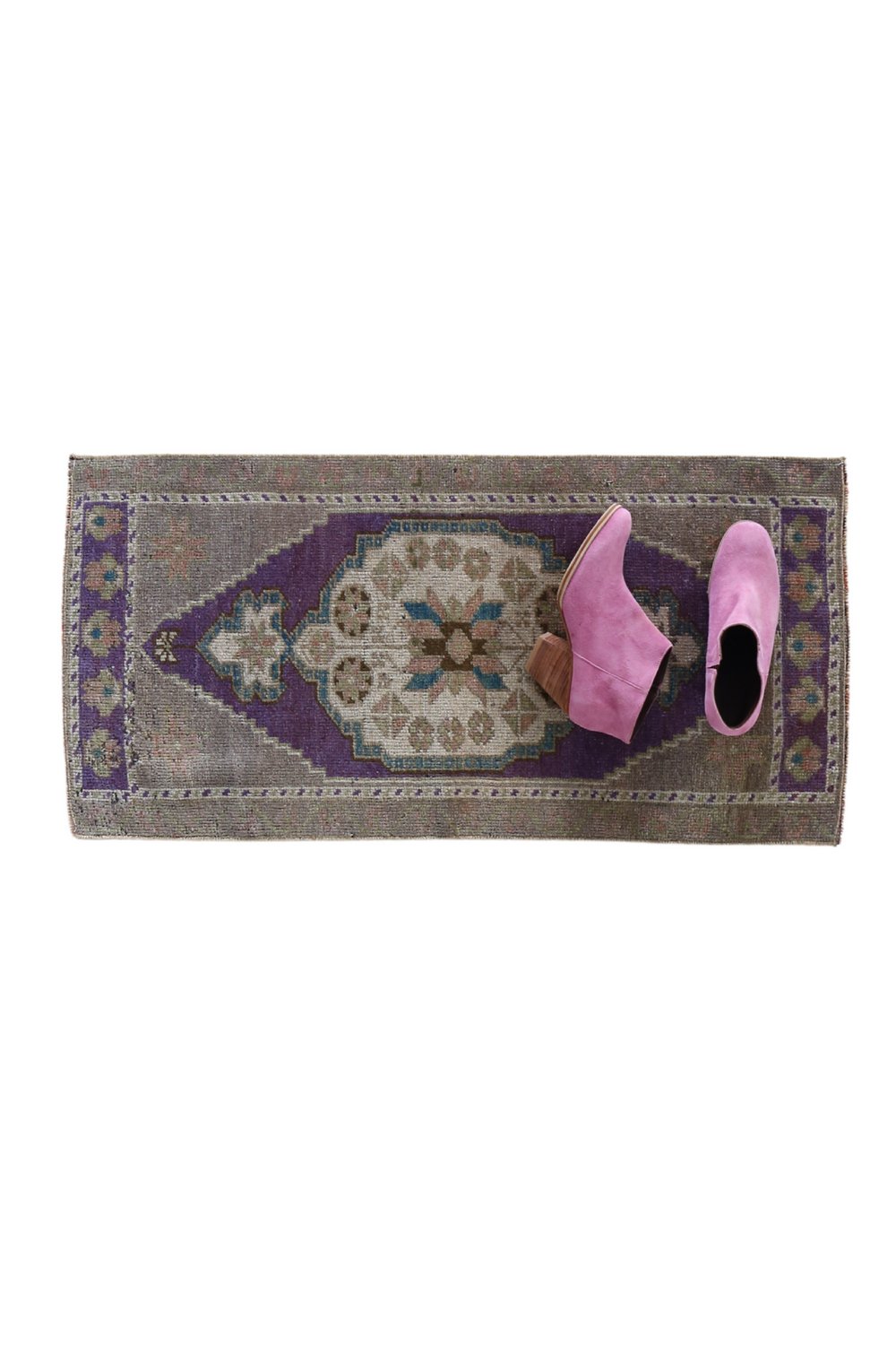 No. 1705 Mini Turkish Vintage Rug - 1'6.5" x 3'1" - Canary Lane
Handwoven rectangular rug with an intricate geometric pattern, featuring a purple and beige color scheme, floral motifs, and a symmetrical central medallion design.