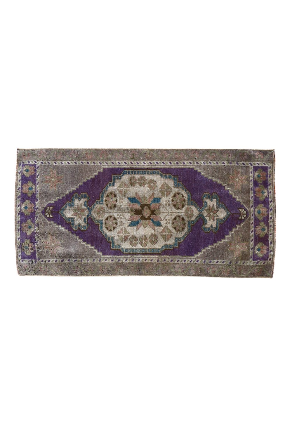 No. 1705 Mini Turkish Vintage Rug - 1'6.5" x 3'1" - Canary Lane

Handwoven rectangular rug with an intricate geometric pattern, featuring a purple and beige color scheme, floral motifs, and a symmetrical central medallion design.