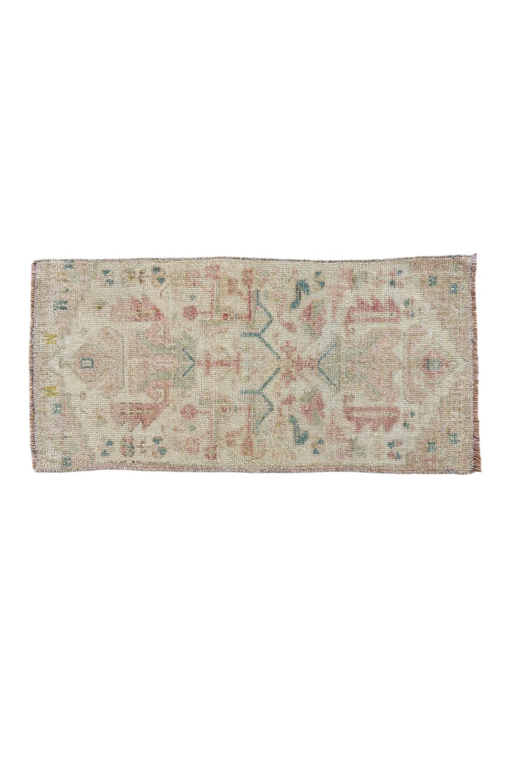 No. 1712 Mini Turkish Vintage Rug - 1'4" x 2'9" - Canary Lane
Faded rectangular rug with a delicate pastel color palette, featuring subtle geometric and floral patterns in muted tones of pink, blue, and beige, giving it a vintage and worn aesthetic.