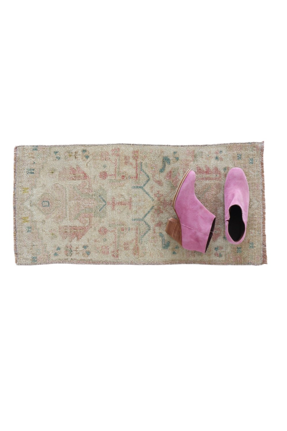 No. 1712 Mini Turkish Vintage Rug - 1'4" x 2'9" - Canary Lane
Faded rectangular rug with a delicate pastel color palette, featuring subtle geometric and floral patterns in muted tones of pink, blue, and beige, giving it a vintage and worn aesthetic.