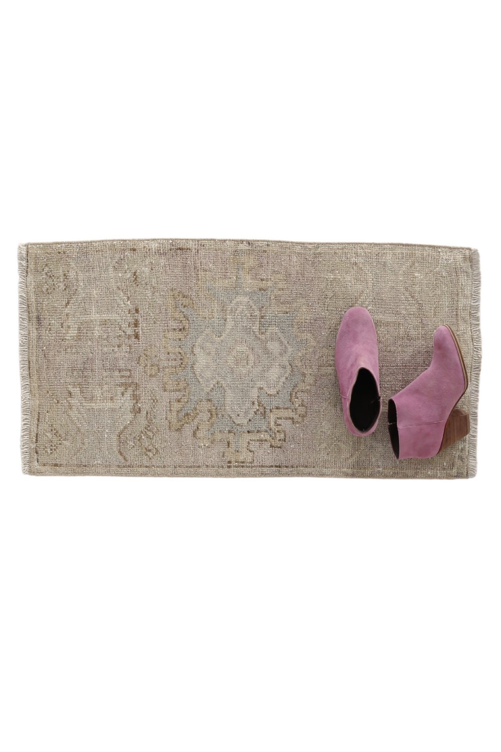 No. 1714 Mini Turkish Vintage Rug - 1'7" x 3'0" - Canary Lane
Neutral-toned rectangular rug with a weathered appearance, showcasing a soft central medallion design in pale blue and beige hues, surrounded by faint geometric and ornamental patterns.