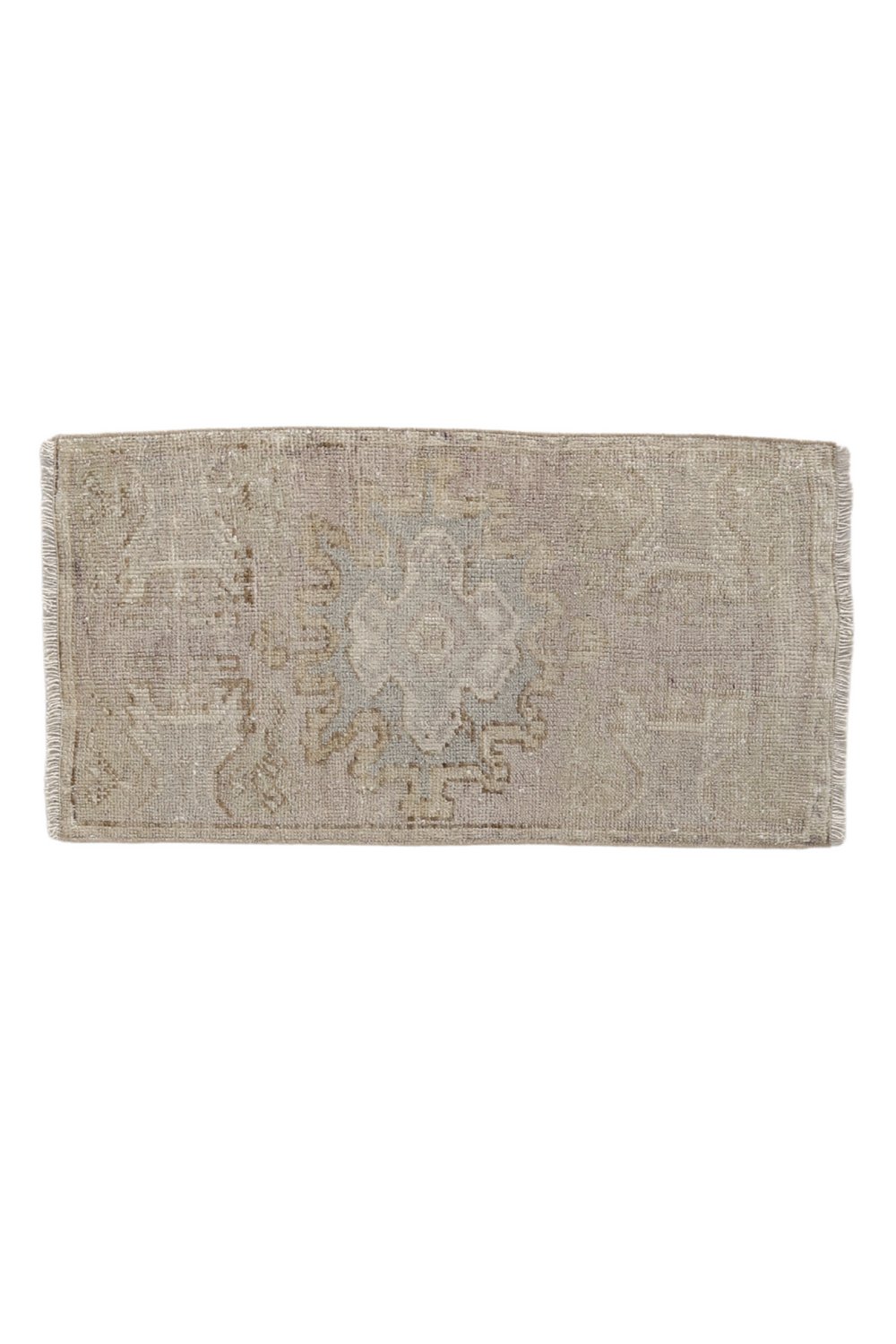 No. 1714 Mini Turkish Vintage Rug - 1'7" x 3'0" - Canary Lane
Neutral-toned rectangular rug with a weathered appearance, showcasing a soft central medallion design in pale blue and beige hues, surrounded by faint geometric and ornamental patterns.