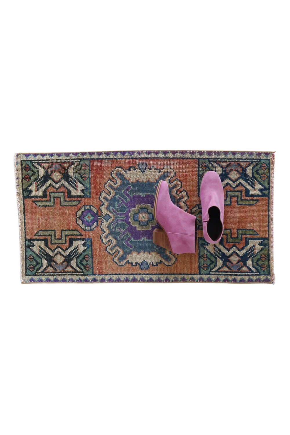 No. 1719 Mini Turkish Vintage Rug - 1'7" x 2'11.5" - Canary Lane
Colorful rectangular rug with a central medallion design in shades of blue and purple, framed by vibrant terracotta panels. Features intricate geometric patterns in green, navy, and beige, with a decorative border incorporating purple and blue accents.