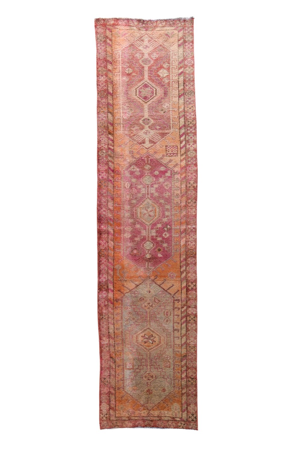 'Seaford' Vintage Turkish Runner - 2'8.5" x 11'1" - Canary Lane
Vintage handwoven Turkish runner featuring intricate patterns and rich textures. The design showcases traditional craftsmanship with bold geometric shapes and detailed motifs. The color palette includes faded peach, tan, cream, pink, red, and gray, creating a harmonious blend of warm and cool tones. 